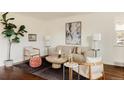 Bright living room showcasing a plush sofa, contemporary artwork, and elegant lighting fixtures at 4420 W 27Th Ave, Denver, CO 80212