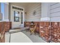 Cozy front porch features a charming seating area, perfect for relaxing outdoors at 3109 Newport Cir, Castle Rock, CO 80104