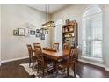 Charming dining room featuring a rustic wooden table and hardwood floors at 1430 Milbury St, Castle Rock, CO 80104