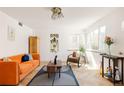 Bright living room with large windows, designer furniture, and stylish accents at 1010 N Jasmine St, Denver, CO 80220