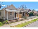 Street view featuring the cozy exterior and small front yard of a charming home at 4636 Leaf Ct, Denver, CO 80216