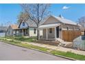 Street view displaying the home exterior and small front yard, complemented by mature tree at 4636 Leaf Ct, Denver, CO 80216