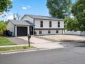 Charming two-story home with a well-maintained front yard and attached garage at 1642 S Salida Way, Aurora, CO 80017