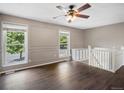 Upstairs living room showcasing hardwood floors and bright natural light at 1642 S Salida Way, Aurora, CO 80017