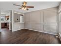 Inviting living room featuring hardwood floors and decorative wall molding at 1642 S Salida Way, Aurora, CO 80017