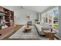 Bright living room with modern decor, vaulted ceilings, and large windows offering plenty of natural light at 4961 W 98Th Ave, Westminster, CO 80031