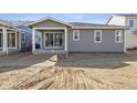 Backyard featuring a covered patio with sliding glass doors, perfect for outdoor entertaining at 24719 E 39Th Ave, Aurora, CO 80019