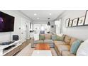 Spacious living room featuring a comfortable sectional sofa and open layout at 3938 Kalamath St, Denver, CO 80211