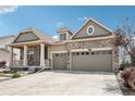 Charming two-story home with stone accents, covered porch, and attached two-car garage at 27196 E Alder Dr, Aurora, CO 80016