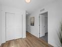 Bright hallway with wood floors, closet, and access to multiple rooms at 1335 N Alton St, Aurora, CO 80010