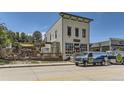 Commercial building with outdoor seating and a food truck at 39420 Congress Ln, Elizabeth, CO 80107