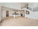 Open-concept living area connects the kitchen and staircase, creating an inviting space at 39420 Congress Ln, Elizabeth, CO 80107