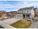 Two-story home with three car garage, neutral colors, landscaping and a inviting front porch at 6065 Clover Ridge Cir, Castle Rock, CO 80104