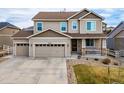 Charming two-story home featuring a two-car garage, well-maintained lawn, and beautiful curb appeal at 6065 Clover Ridge Cir, Castle Rock, CO 80104