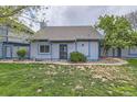 Inviting home featuring manicured lawn, with a walkway leading to the front door at 2488 S Victor St # E, Aurora, CO 80014