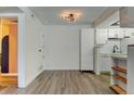 Bright living room with modern flooring, neutral paint, and contemporary light fixture at 8555 Fairmount Dr # C202, Denver, CO 80247