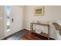 Bright entryway with hardwood floors and console table at 25077 E Canal Pl, Aurora, CO 80018