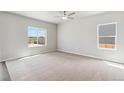 Inviting bedroom with neutral carpet and large windows, providing plenty of natural light at 7244 Arkansas St, Frederick, CO 80530