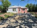 A single Gathering home with a concrete driveway in front of the house at 1266 Del Mar Pkwy, Aurora, CO 80010