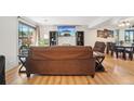 Relaxing living room features a stone fireplace and sliding door access to a patio at 6462 E Bates Ave, Denver, CO 80222
