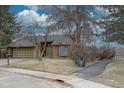 Charming single-Gathering home featuring a two-car garage and lush landscaping, perfect for suburban living at 7690 S Uinta Ct, Centennial, CO 80112