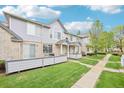 Townhouse exteriors feature well-manicured lawns and ample street parking for residents and guests at 1259 W 112Th Ave # B, Denver, CO 80234