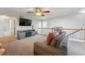 Cozy living room with plush seating, entertainment center, and plenty of natural light at 4705 Andes St, Denver, CO 80249