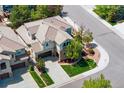Aerial view of the lovely home, featuring a landscaped yard and attached garage at 10832 Montvale Cir, Highlands Ranch, CO 80130