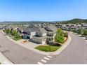 Stunning aerial view of a home situated on a corner lot in a neighborhood near the mountains at 1382 Raindrop Way, Castle Rock, CO 80109