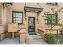 Close up of an entryway door with a secure mailbox and a classic covered porch at 960 N Sherman St # 3F, Denver, CO 80203