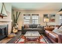 Comfortable living room with a decorative fireplace, stylish furnishings, and natural light at 960 N Sherman St # 3F, Denver, CO 80203
