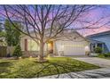 Inviting single-Gathering home with mature tree, manicured lawn, and attached two-car garage in a quiet neighborhood at 2556 E 131St Pl, Thornton, CO 80241