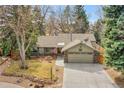 Attractive home boasts a well-maintained lawn, two-car garage, and inviting curb appeal at 5050 W 102Nd Ave, Westminster, CO 80031