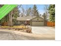 Charming single-story home featuring a well-manicured lawn, a two-car garage, and an inviting entrance at 5050 W 102Nd Ave, Westminster, CO 80031