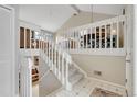 Spacious staircase with white railing leading to an upper level area, providing architectural interest at 5050 W 102Nd Ave, Westminster, CO 80031