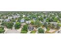 Expansive aerial view of a neighborhood showcasing tree-lined streets and various single-Gathering homes at 19334 E Prentice Pl, Centennial, CO 80015