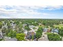 Scenic aerial view of the neighborhood highlighting lush green trees, sprawling lawns, and residential properties at 19334 E Prentice Pl, Centennial, CO 80015