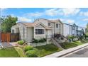 Charming two-story home featuring a well-maintained lawn and landscaped garden with a stepped walkway at 113 Rockaway Ave, Castle Rock, CO 80104