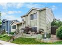Charming two-story home with a well-maintained lawn and landscaped garden, featuring a neatly stepped walkway at 113 Rockaway Ave, Castle Rock, CO 80104