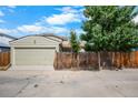A single-Gathering home with a two-car garage and wooden fence in a well-kept neighborhood at 113 Rockaway Ave, Castle Rock, CO 80104