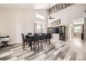 Spacious dining room with high ceilings and large windows provides ample natural light at 334 Octillo St, Brighton, CO 80601
