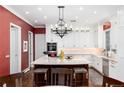 Open-concept kitchen with island, marble counters, pendant lighting, and stainless steel appliances at 4 Cherry Hills Farm Dr, Cherry Hills Village, CO 80113