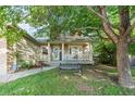 Inviting front porch with a cozy bench, perfect for enjoying the outdoors at 634 E 130Th Way, Thornton, CO 80241