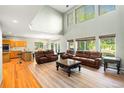 Spacious living room with vaulted ceilings, lots of windows, and comfortable seating at 634 E 130Th Way, Thornton, CO 80241
