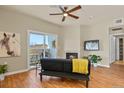 Modern living room featuring hardwood floors, a cozy fireplace, and sliding glass doors to a balcony at 5537 Lewis Ct # 101, Arvada, CO 80002