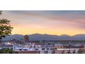 Scenic city view with mountains in the background on a beautiful day during sunset in Denver, Colorado at 2721 Curtis St, Denver, CO 80205