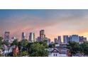 Stunning city view featuring modern architecture and lush trees in a vibrant urban setting at 2721 Curtis St, Denver, CO 80205