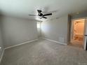 Spacious bedroom with ceiling fan and carpet flooring at 18308 E 93Rd Pl, Commerce City, CO 80022