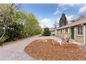 Charming brick home with great curb appeal, featuring a well-maintained front yard and inviting entryway at 3715 Wolff St, Denver, CO 80212