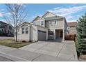 Charming two-story home with a well-maintained lawn, driveway, and mature trees at 3917 Starry Night Loop, Castle Rock, CO 80109